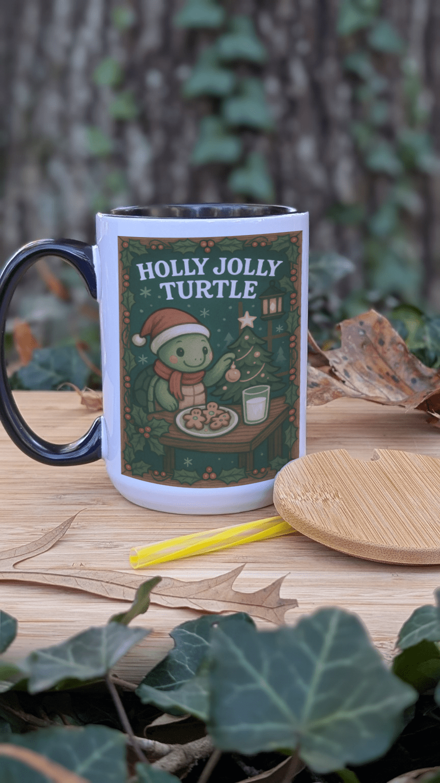 Mug with 'Holly Jolly Turtle' design on a wooden surface with leaves and a tree in the background